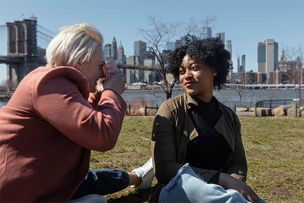 Elderly person and caregiver sharing a warm moment over tea