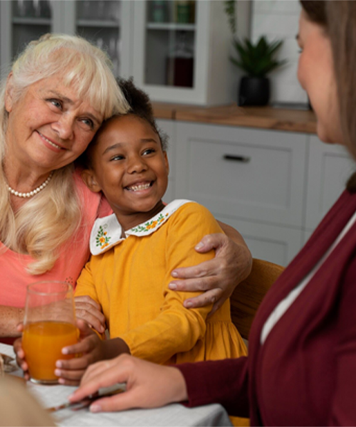 Family caregiver taking a peaceful moment while professional carer is with elderly relative